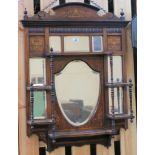 An inlaid rosewood mirror from the top of a cabinet, 90cm high x 64cm wide Condition Report: