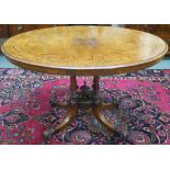 A Victorian walnut inlaid oval table, 72cm high x 113cm wide x 80cm deep Condition Report: Available