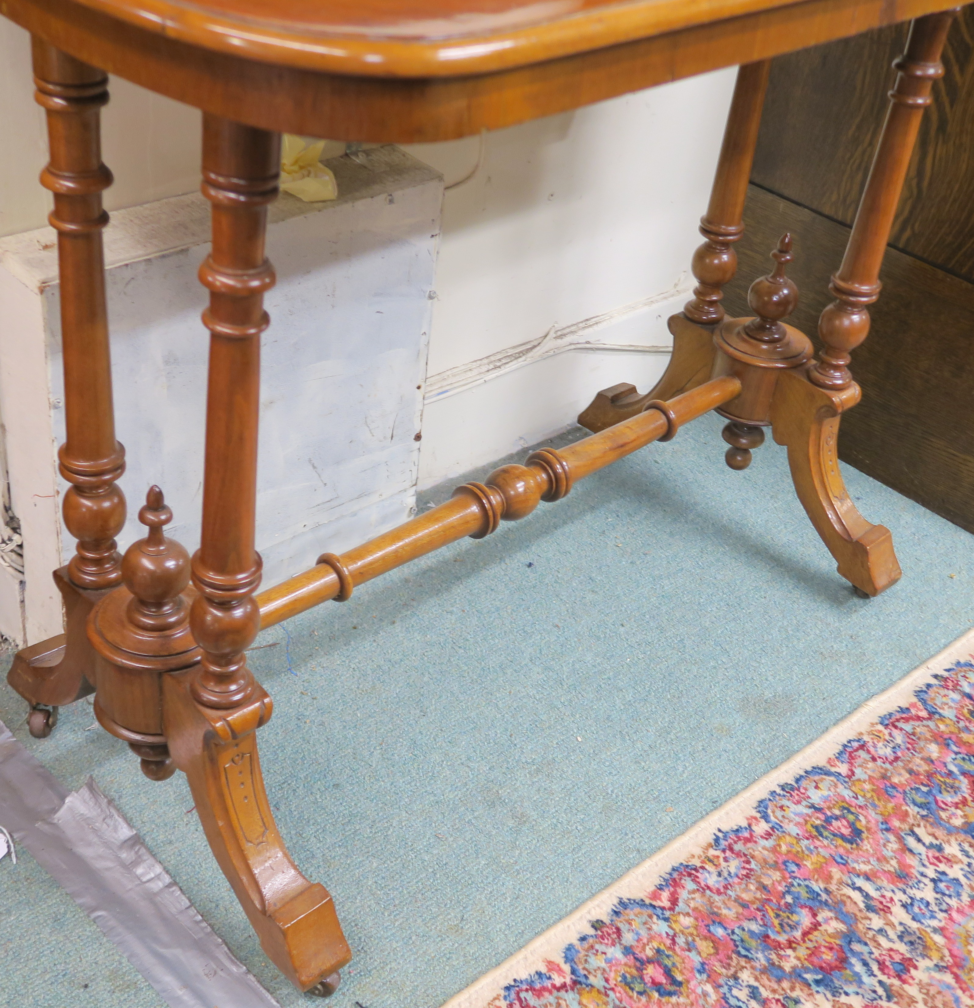 A Victorian walnut side table with turned supports and stretcher, 71cm high x 90cm wide x 45cm - Image 2 of 3