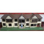 A Tri-ang dolls house in the Tudor style with electric fittings, 42cm high x 115cm wide x 27cm