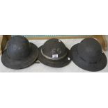 Three military helmets (3) Condition Report: Available upon request