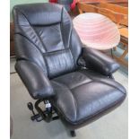 A black leather swivel reclining chair Condition Report: