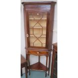 A 19th Century inlaid mahogany corner cabinet with single glazed door on stand, 203cm high x 80cm