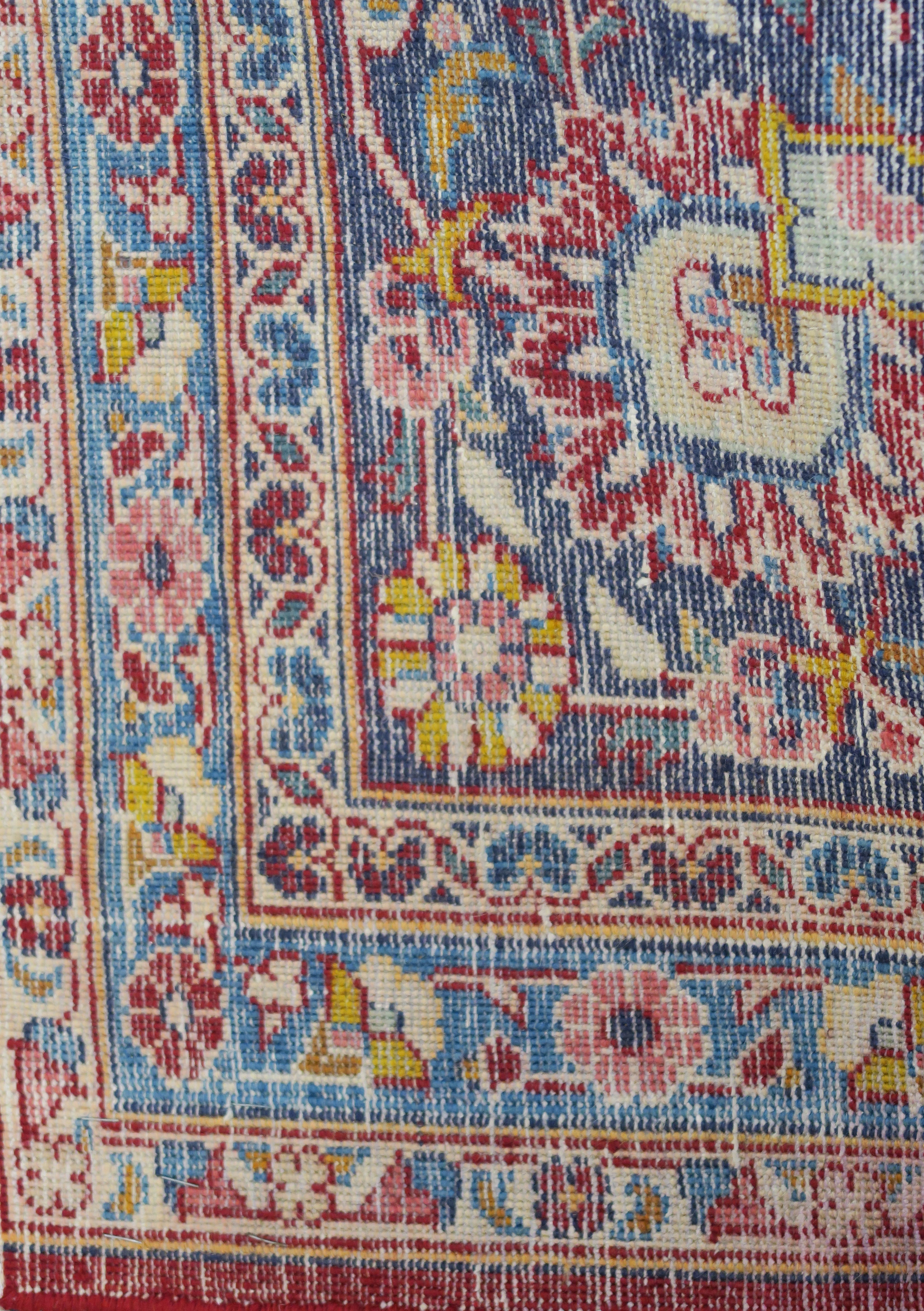 A large red ground Keshan rug with traditional design of blue central medallion, matching - Image 5 of 5