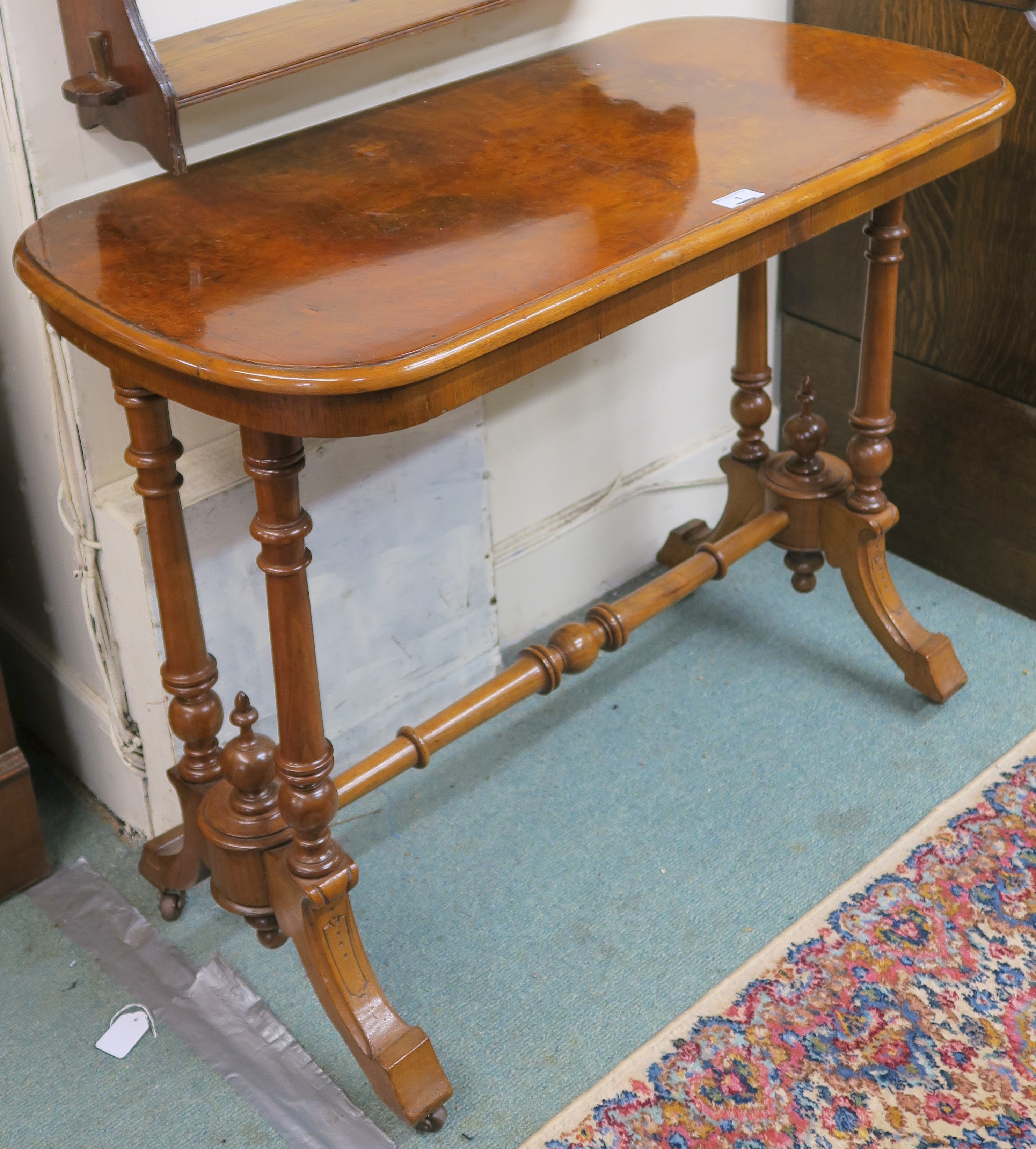 A Victorian walnut side table with turned supports and stretcher, 71cm high x 90cm wide x 45cm