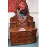 A mahogany dressing chest with oval mirror, 185cm high x 118cm wide x 56cm deep Condition Report: