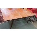 A mid-Century teak extending dining table, 73cm high x 183cm wide x 84cm deep Condition Report: