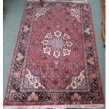 A pink ground Asfahan rug with central medallion and matching spandrels, 156cm x 104cm Condition