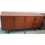 An I B Koford larsen for G plan teak sideboard with five central drawers flanked by two doors,