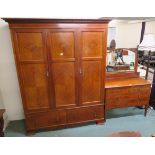 An inlaid mahogany three door fitted wardrobe with two lower drawers on bracket feet, 204cm high x