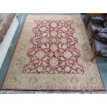 A red ground Eastern style rug with allover floral design, 370cm x 278cm Condition Report: Available