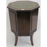 A mahogany octagonal drinks cabinet with green leather inset, 70cm high x 46cm wide x 46cm deep