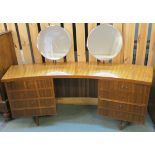 A Morris of Glasgow Cumbrae walnut curved dressing table with two banks of four drawers with twin