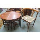 A circular mahogany table with four nesting tables, 49cm high x 76cm diameter and a corner chair (2)