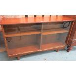 A Mid Century teak bookcase with glass sliding doors, 75cm high x 122cm wide x 31cm deep Condition