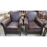A pair of brown vinyl armchairs (2) Condition Report: Available upon request