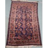 An Eastern rug with geometric design, 215cm x 132cm Provenance: The Late Dr Helen. E. C. Cargill