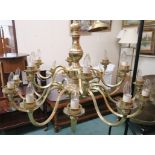 A large modern brass sixteen branch chandelier, 70cm high x 100cm wide Condition Report: Available