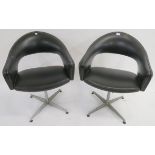 A pair of Mid Century black vinyl swivel chairs, 78cm high (2) Condition Report: Available upon