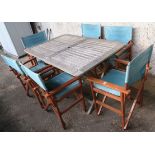 A teak folding garden table, 76cm high x 140cm wide x 90cm deep with six wooden folding chairs (7)