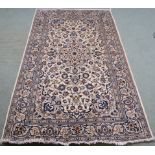 A cream ground fine Keshan rug with allover floral design, 255cm x 150cm Condition Report: Available