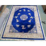 A large blue ground Chinese rug, 366cm x 274cm Condition Report: