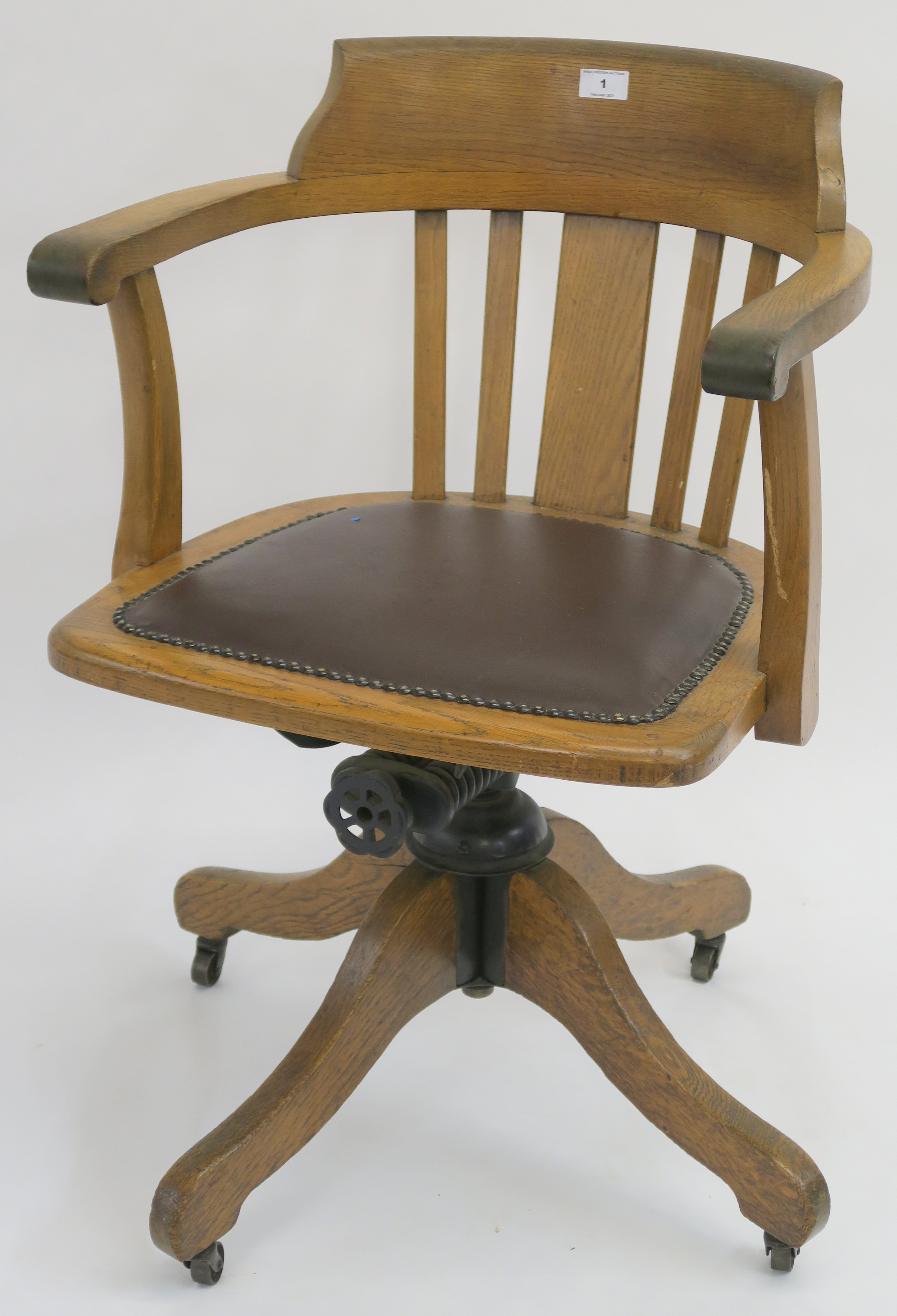 An oak swivel office chair Condition Report: Available upon request