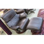 An Ekorness Stressless brown leather swivel reclining chair with matching stool (2) Condition