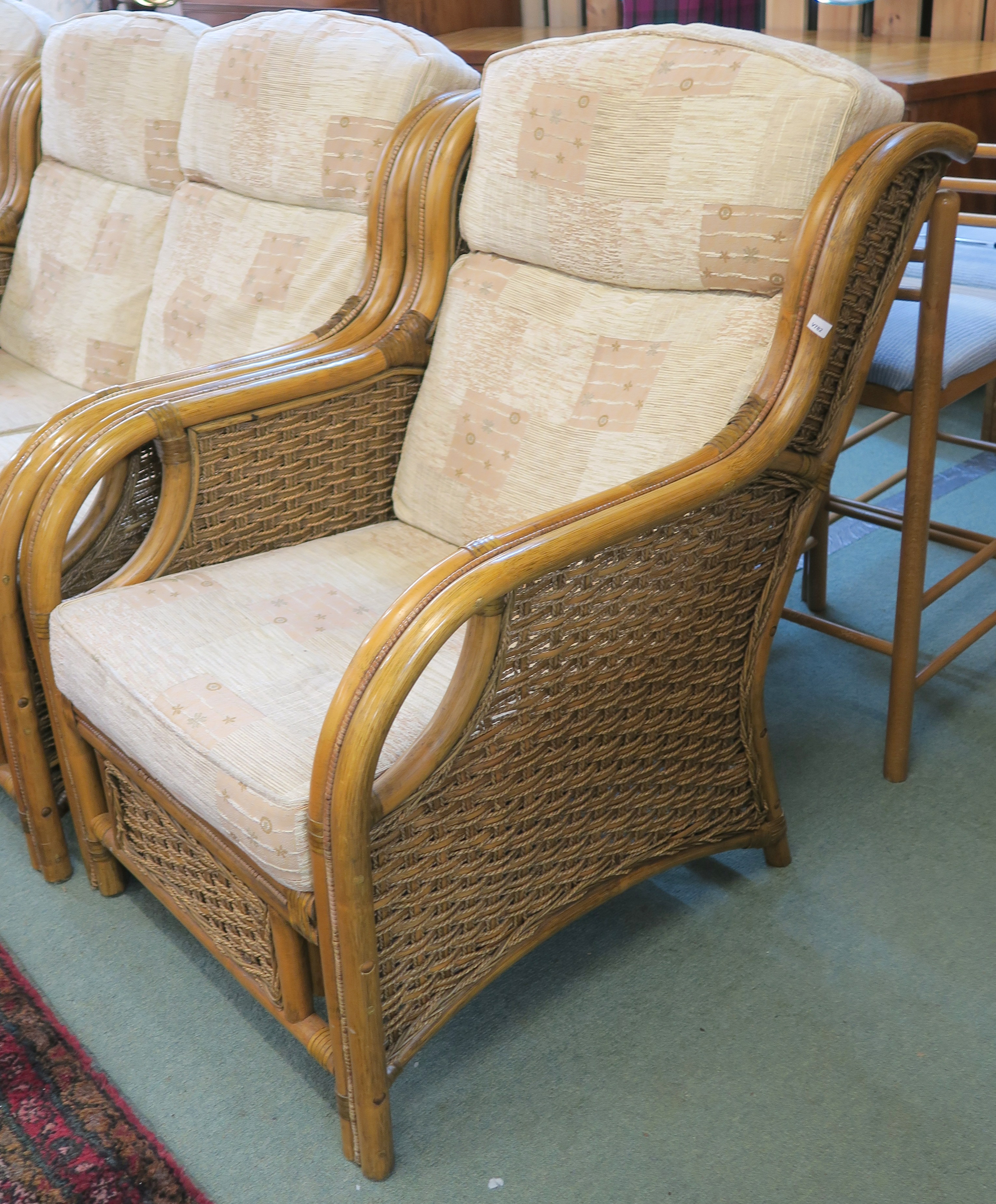 A cane three piece suite with two seater sofa and two chairs with a light fabric upholstery (3) - Image 2 of 2