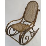 A bentwood rocking chair with cane seat and back, 100cm high Condition Report: Has some signs of