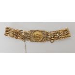 A 9ct gold gate bracelet set with a 1980 1/10th Krugerrand coin, weight combined 13.8gms there is no