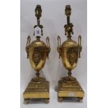 A pair of gilded French table lamps with rams head handles, 50cm high Condition Report: Available