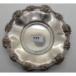 A silver nut dish, Sheffield 1855, circular with applied foliate motifs, 18.5cm diameter, 304gms