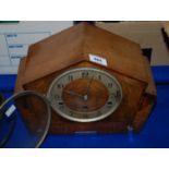 An oak cased mantle clock (def) Condition Report: Available upon request