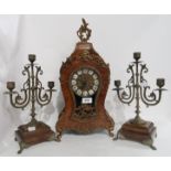 A faux wooden clock of French design, the German movement with numbers 131-070, 48cm high together