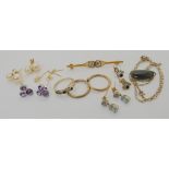 A collection of 9ct and yellow metal earrings to include amethyst, aquamarine and pearl, a New