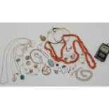 A string of carnelian beads, a silver turquoise pendant, silver chains and other items Condition