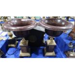 A pair of large decorative metal urns on stands, 46cm high Condition Report: Available upon request