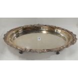 A silver plated serving dish, oval shaped on four scrolling feet, 50cm x 32cm Condition Report: