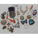 A silver Cow & Gate 'Smiler' silver charm, a white metal pearl set plaited hair mourning locket, a