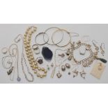 A silver charm bracelet, a silver babies bangle, rings, chains and other items Condition Report: Not
