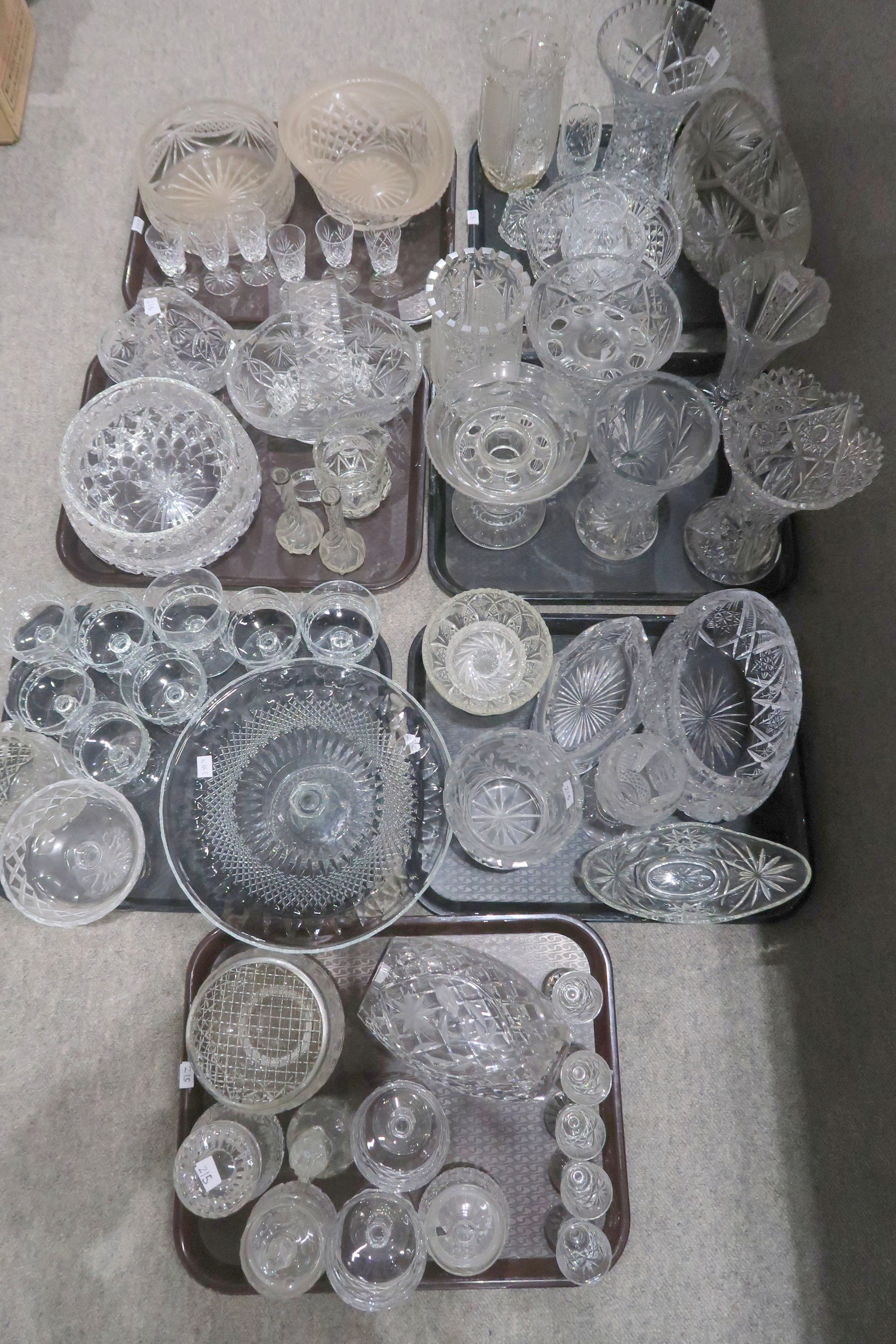 A large collection of cut glass, crystal and other glassware including bowls, vases, dishes etc