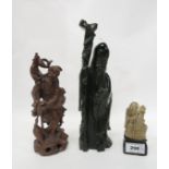 A carved wooden figure of a sage, a dark green hardstone example and another Condition Report: