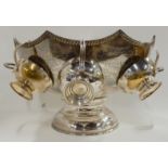 A silver plate twin handled punch bowl with four serving cups, 20.5cm high Condition Report: Not