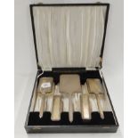A cased six piece silver backed dressing table set, London 1948 Condition Report: Not available