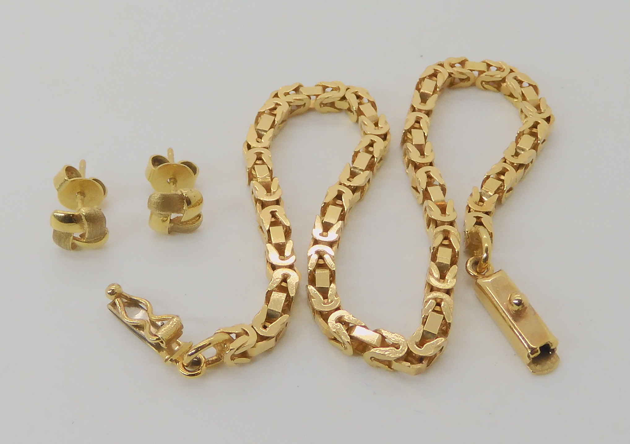 A 9ct gold Italian made chain bracelet, length 20cm, together with a pair of knot shaped earrings, - Image 2 of 2