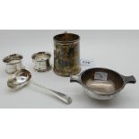 A lot comprising a silver christening mug, Sheffield 1920, a silver ladle, a pair of silver napkin