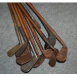 Twelve hickory-shafted golf clubs including one wood Condition Report: Available upon request
