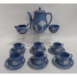 A Wedgwood blue jasperware coffee set comprising pot, milk jug, sugar bowl and six cans and