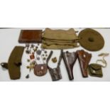 A lot comprising two pistol holsters, a Glengarry, a Bayonet frog cartridge pouch, assorted